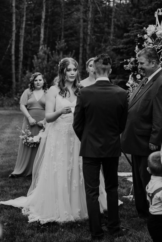 Bride and groom during their wedding ceremony in Northern Minnesota