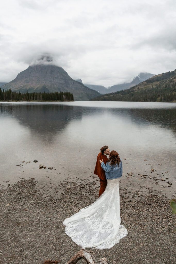 Moody bridal portraits at Pray Lake in Glacier National Park