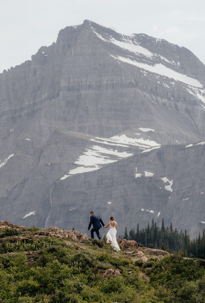 Glacier National Park elopement couple hikes at Many Glacier.