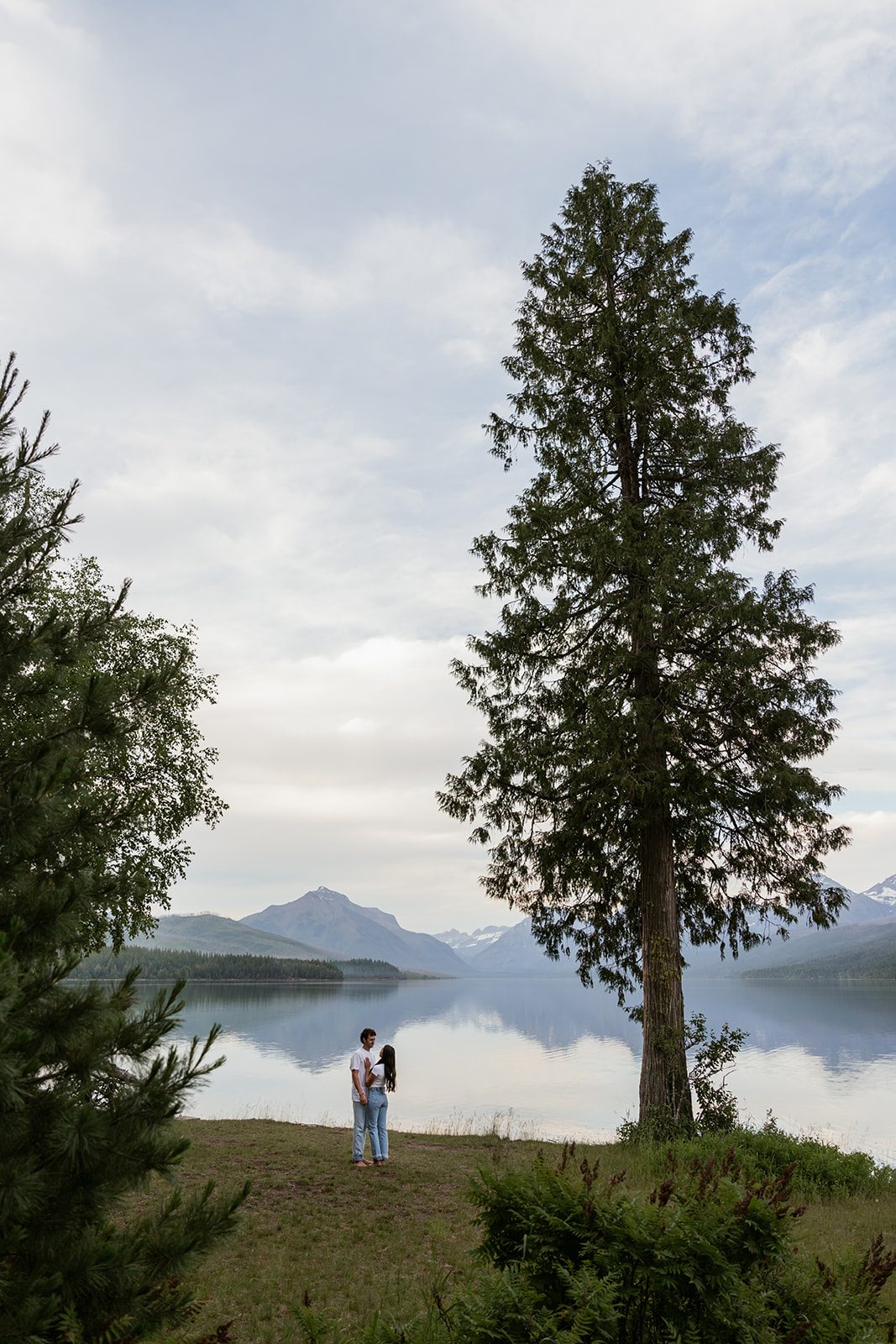 Casual outfits for an adventurous mountain engagement session at Lake McDonald in Glacier National Park