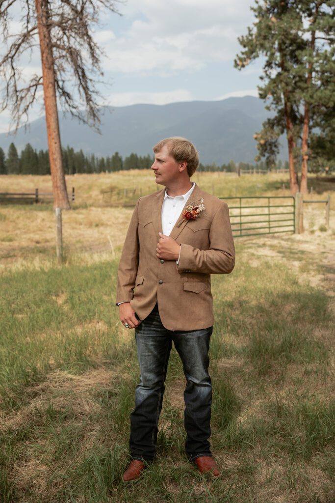 Modern cowboy groom attire for a Northwest Montana intimate wedding near Glacier National Park photographed by Sydney Breann Photography