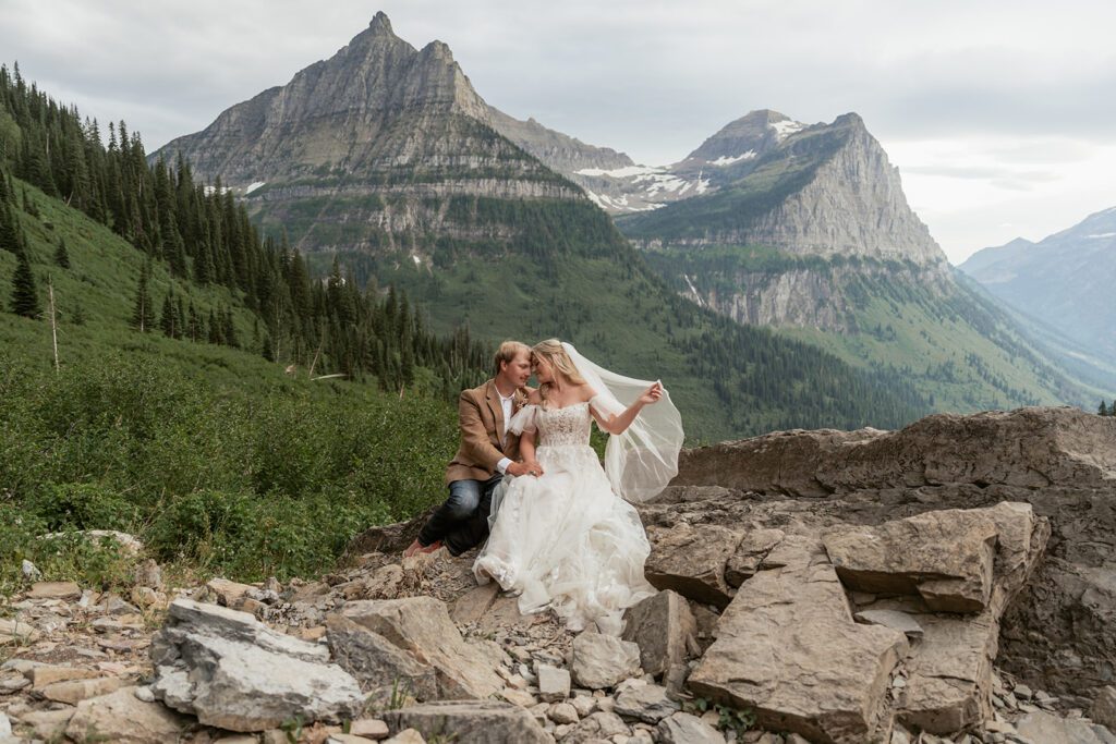 A simple western-inspired bride and groom explore Glacier National Park following their Northwest Montana Airbnb intimate wedding photographed by Sydney Breann Photography