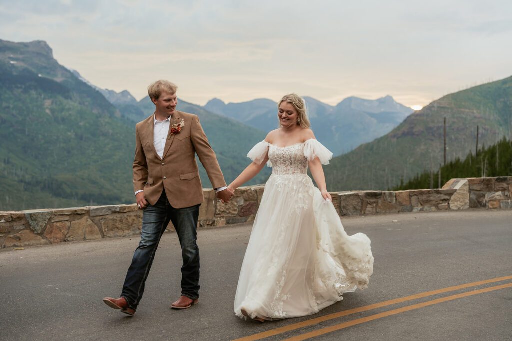 A simple western-inspired bride and groom explore Glacier National Park following their Northwest Montana Airbnb intimate wedding photographed by Sydney Breann Photography