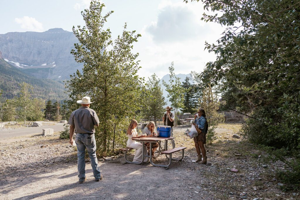 An intimate family picnic at Sun Point in Glacier National Park photographed by Sydney Breann Photography