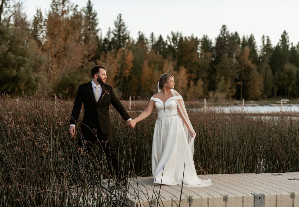 Newlywed portraits during sunset at The Lodge at Whitefish Lake in Northwest Montana photographed by Sydney Breann Photography