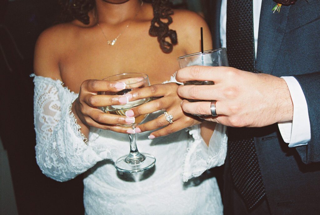 Newlyweds celebrate their marriage at Palm Cocktail Lounge in Whitefish, Montana following their Glacier National Park destination microwedding.