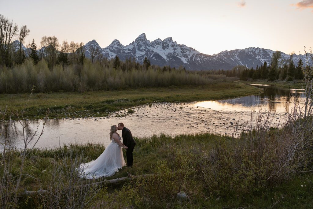 Magical sunset bridal portraits at Schwabacher Landing in Grand Teton National Park following a romantic and intimate mountain elopement.