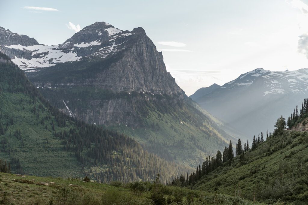 Mountain bride and groom photos at Logan Pass in Glacier National Park following a family-oriented microwedding ceremony at Pray Lake. 