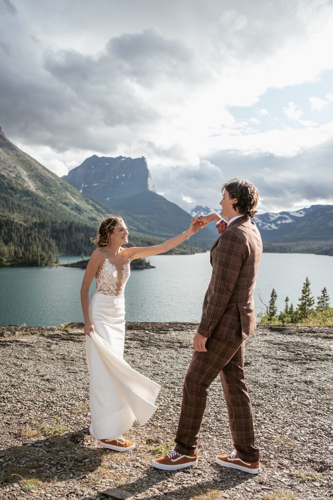 A bride and groom slow dance at Sun Point, following their intimate wedding ceremony.