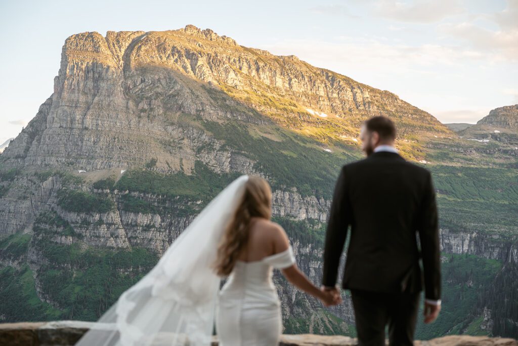 Newlyweds travel to Glacier National Park for magical bridal portraits the day after their intimate backyard wedding in Trout Creek, MT.