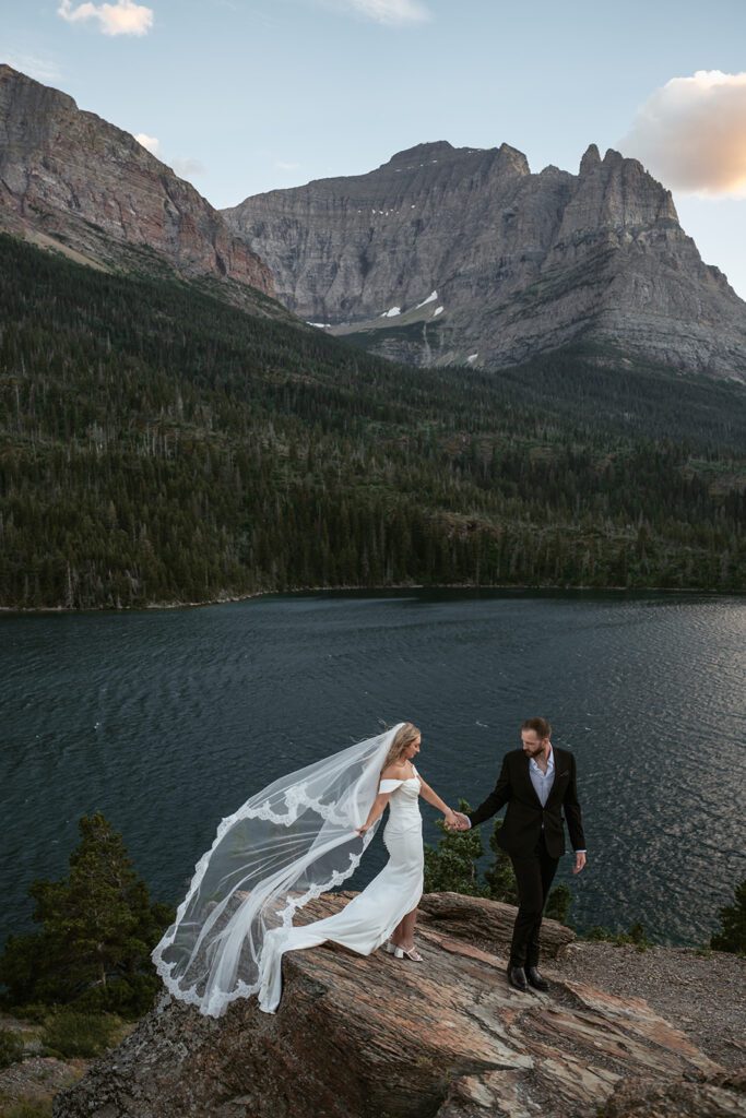 Newlyweds travel to Glacier National Park for magical bridal portraits the day after their intimate backyard wedding in Trout Creek, MT.