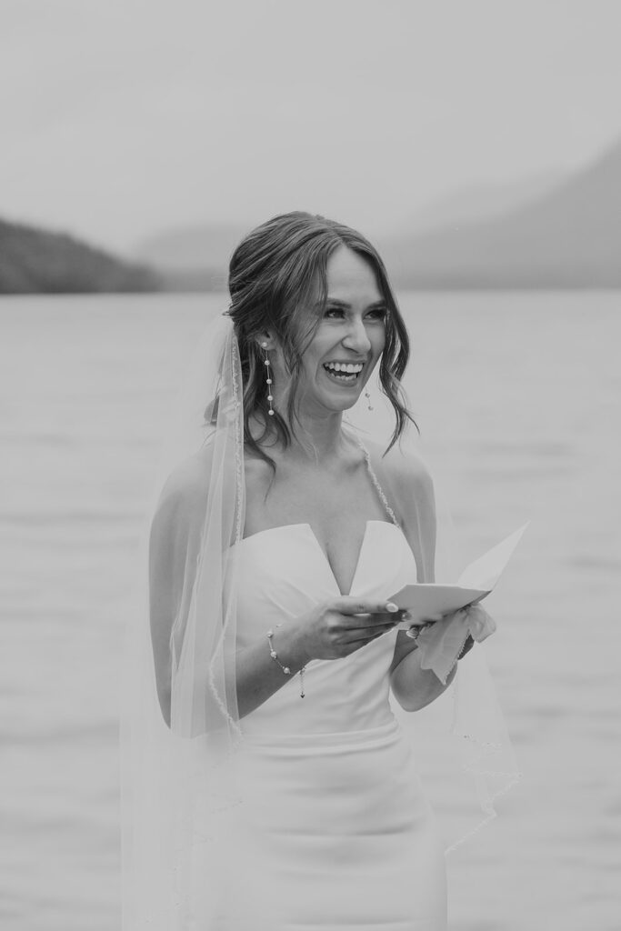Emotional intimate wedding ceremony at Lake McDonald in Glacier National Park photographed by Sydney Breann Photography.