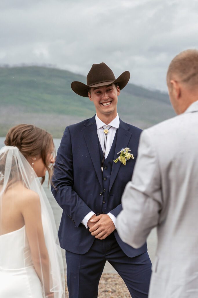 Emotional intimate wedding ceremony at Lake McDonald in Glacier National Park photographed by Sydney Breann Photography.