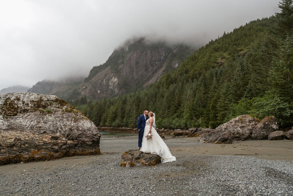 Adventurous bridal portraits at Thumb Cove in Resurrection Bay, photographed by Sydney Breann Photography.