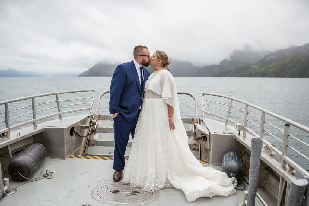 A bride and groom take the Miller’s Landing Water Taxi to Thumb Cove in Resurrection Bay during their Seward, Alaska elopement.