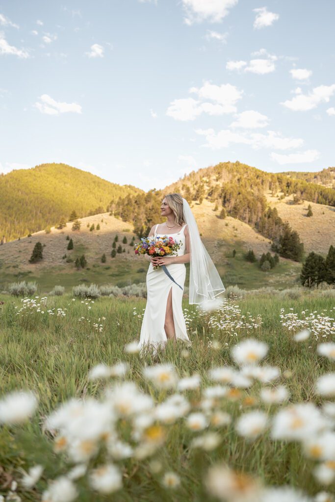 Initmate sunrise wedding ceremony at Durnam Meadow in Big Sky, Montana photographed by Sydney Breann Photography.