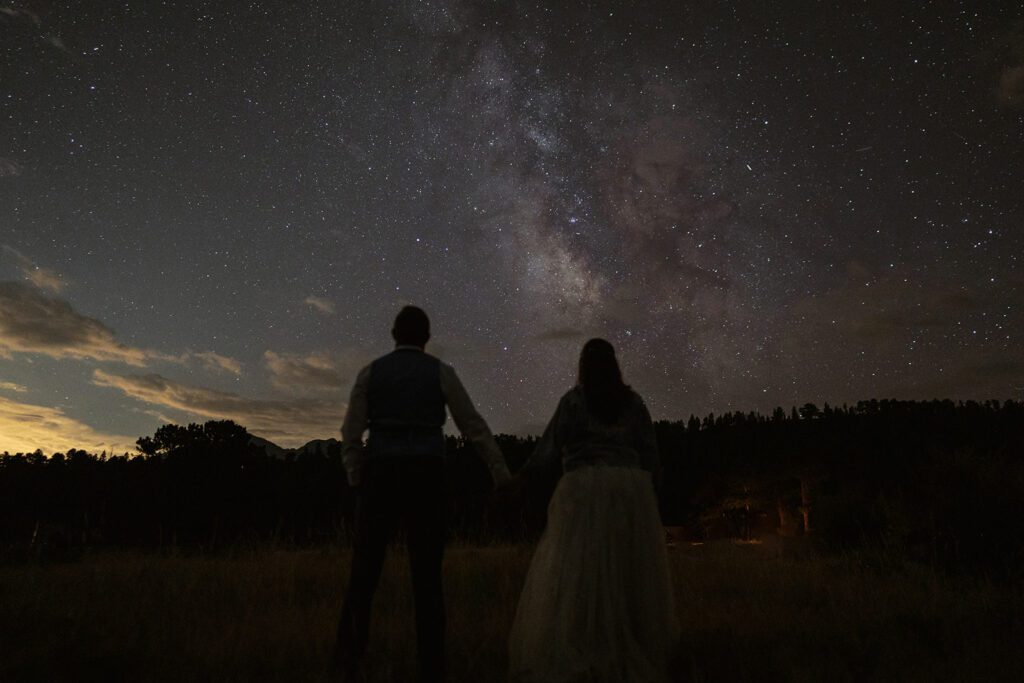 Newlyweds stargaze at the Milky Way in Rocky Mountain National Park