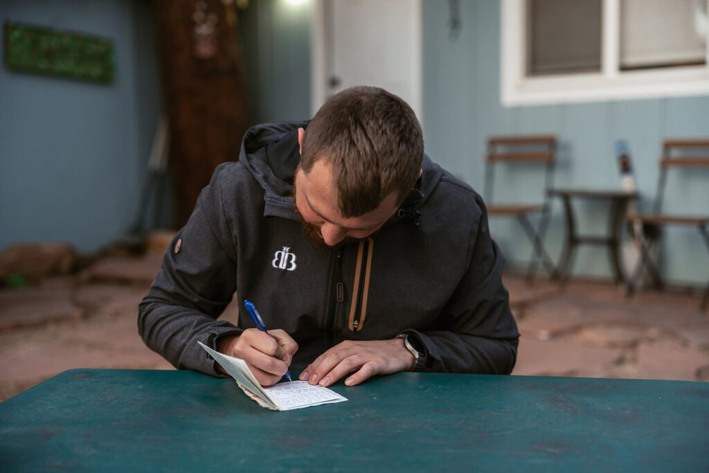 A groom writes his vows on the morning of his wedding day