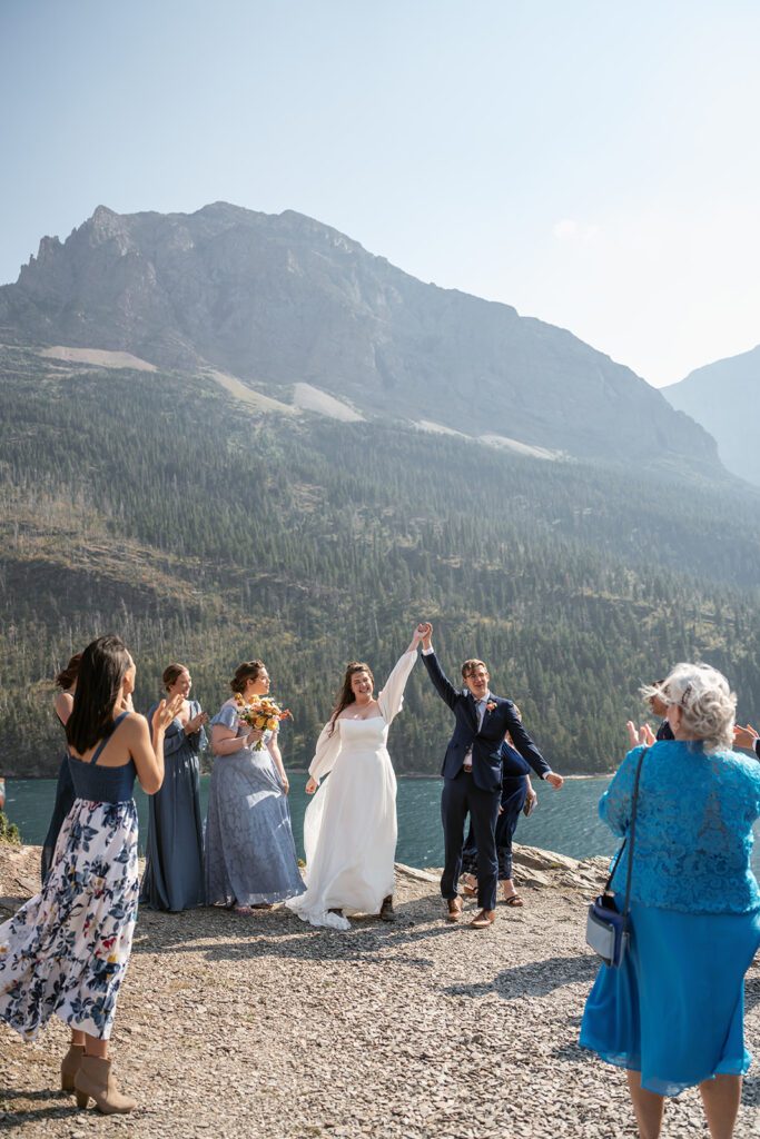 Newlyweds celebrate following their intimate wedding ceremony at Sun Point