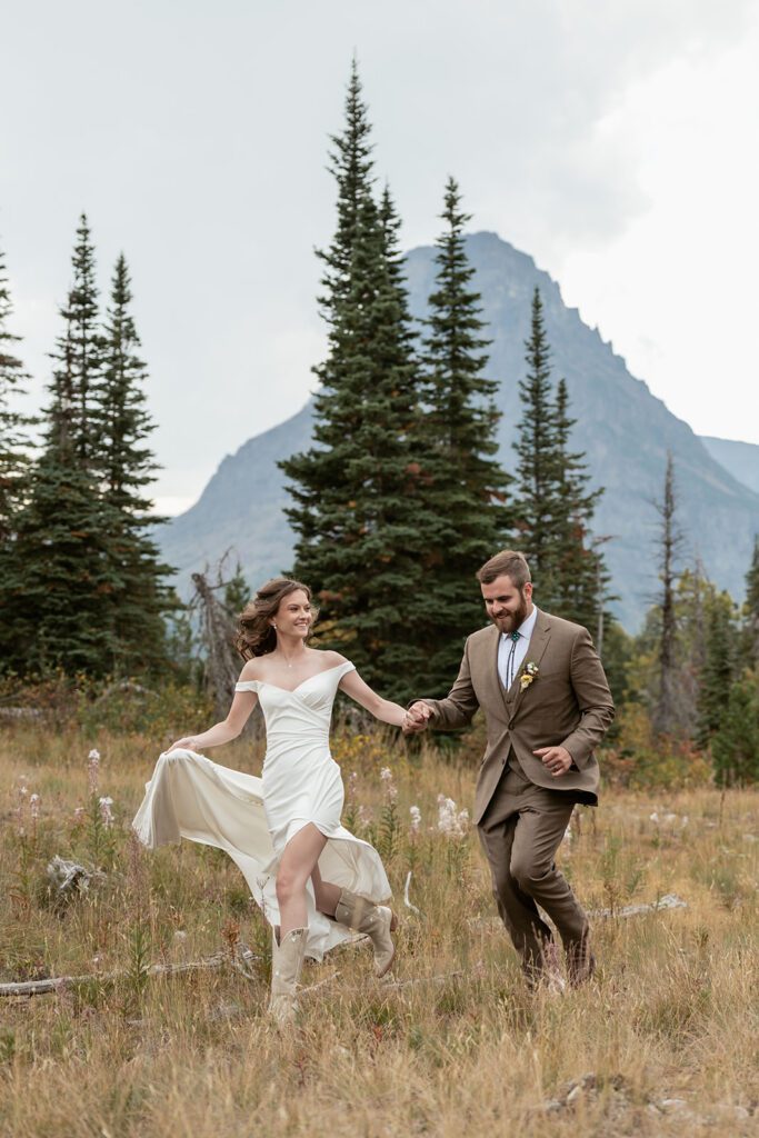 Newlyweds frolic at Two Medicine following their Sun Point sunrise elopement
