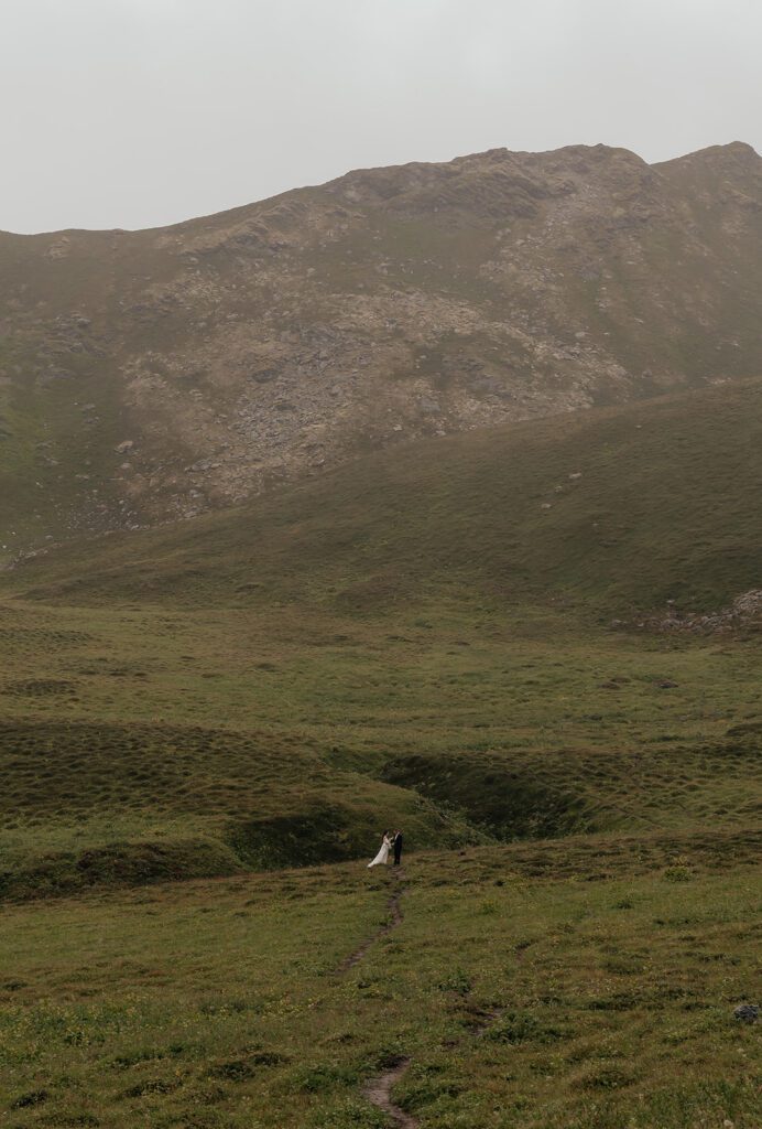 A bride and groom exchange vows at Hatcher Pass, captured by Alaska elopement photographer Sydney Breann