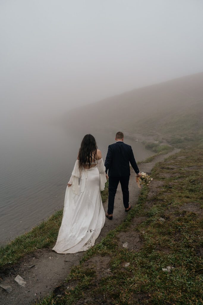Alaska elopement photographer, Sydney Breann Photography, captures a couple strolling in Hatcher Pass